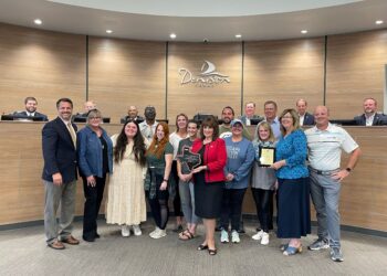 Standing left to right: Denison leaders recognized the local participants in the award-winning Ecommerce Accelerator Incentive program Monday night at the City Council meeting. Present to represent the program were: William Myers, DDA; Elsie Russell, 2 Chicks Home and Market; Jenna Zapata, Zig Zag Galleries; Neal Spencer, Spiffy Spa; Natalie Popplewell, 410 Collective + Coffee; Cathy Cobb, Totally Addicted; Nitia Musico, Monsters on Main; Denison Mayor Janet Gott; Derrick Roberts, Pop Around the Corner; Kimberlea Donohoe-Miller, The Hangin T; Wendy Acosta, The Desk and Easel; Tony Kaai, DDA; Donna Dow, Denison Main Street; and Michael McKinley, Avert 360. Seated left to right, Council members: Brian Hander, Dr. Michael Courtright, Robert Thorne, J.C. Doty, Robert Crawley and Kristofer Spiegel.